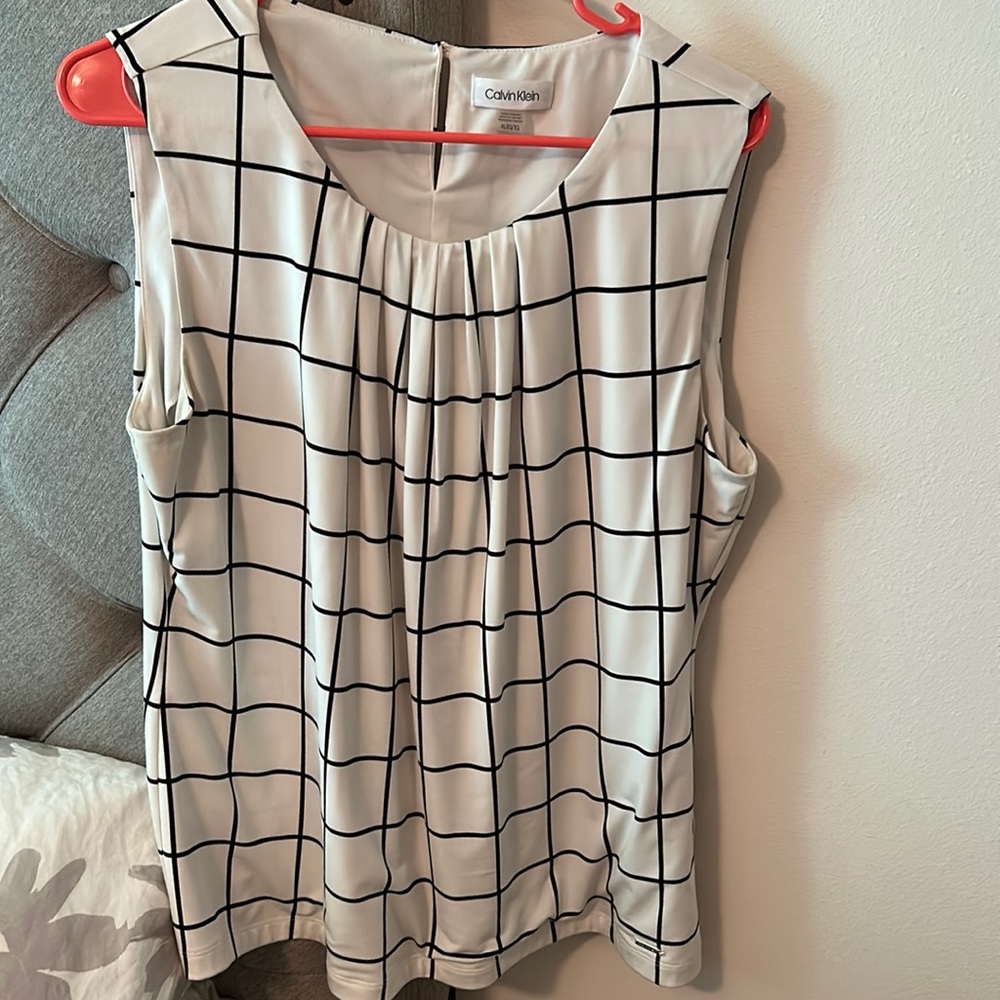 Beautiful top by Calvin Klein.  Gorgeous.  Stretchy material.